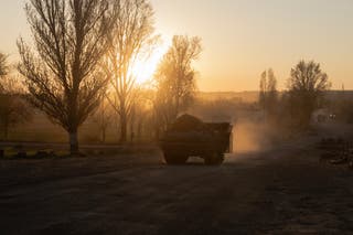 An armoured Ukrainian military vehicle drives on a road in a village not far from the frontline in the Dnipropetrovsk region